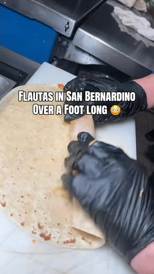 Foot-long flautas being rolled in the kitchen